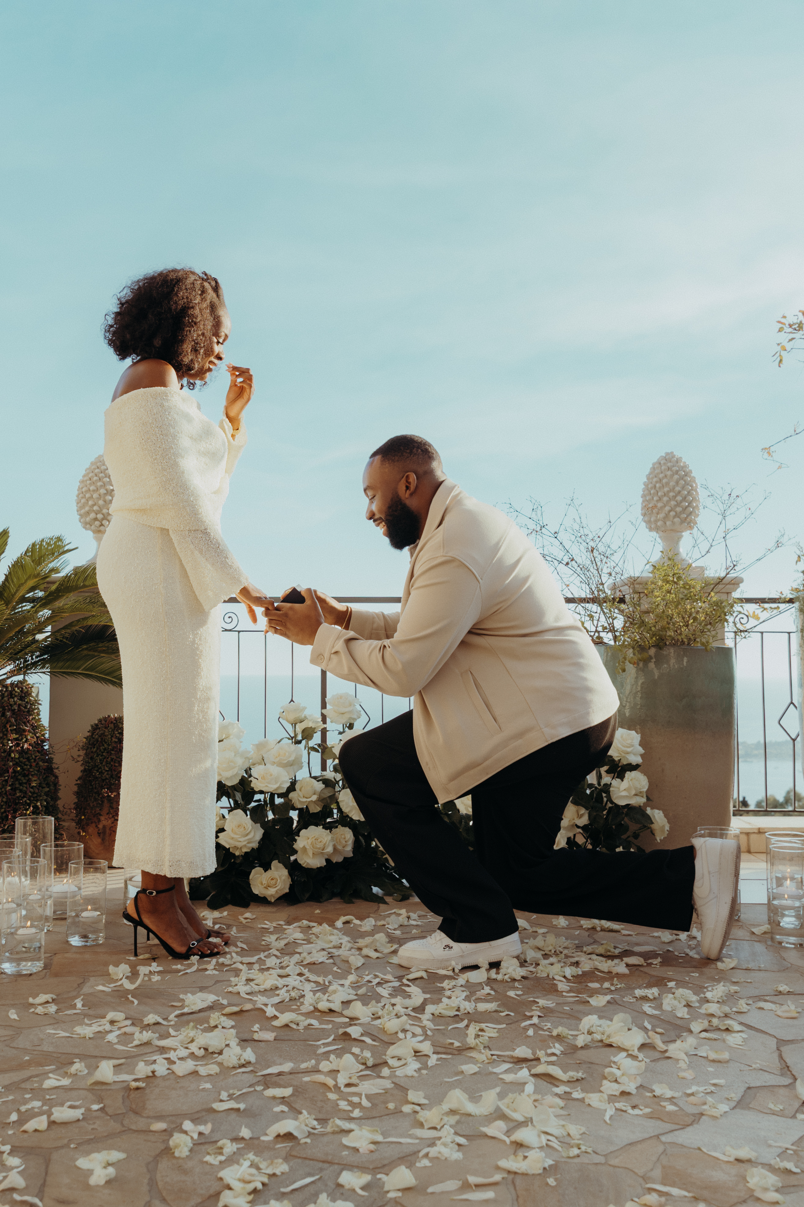 Romantic proposal set-up on a private Taormina terrace with roses, candles and a sweeping sea view