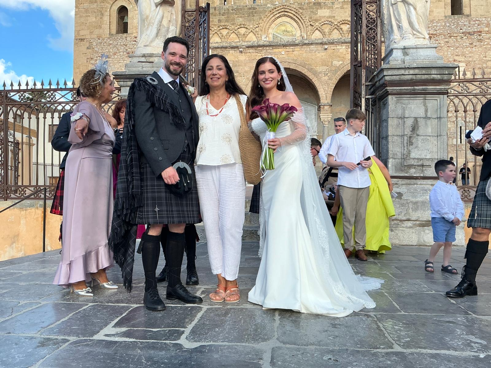Newlyweds with a classic vintage car in Sicily